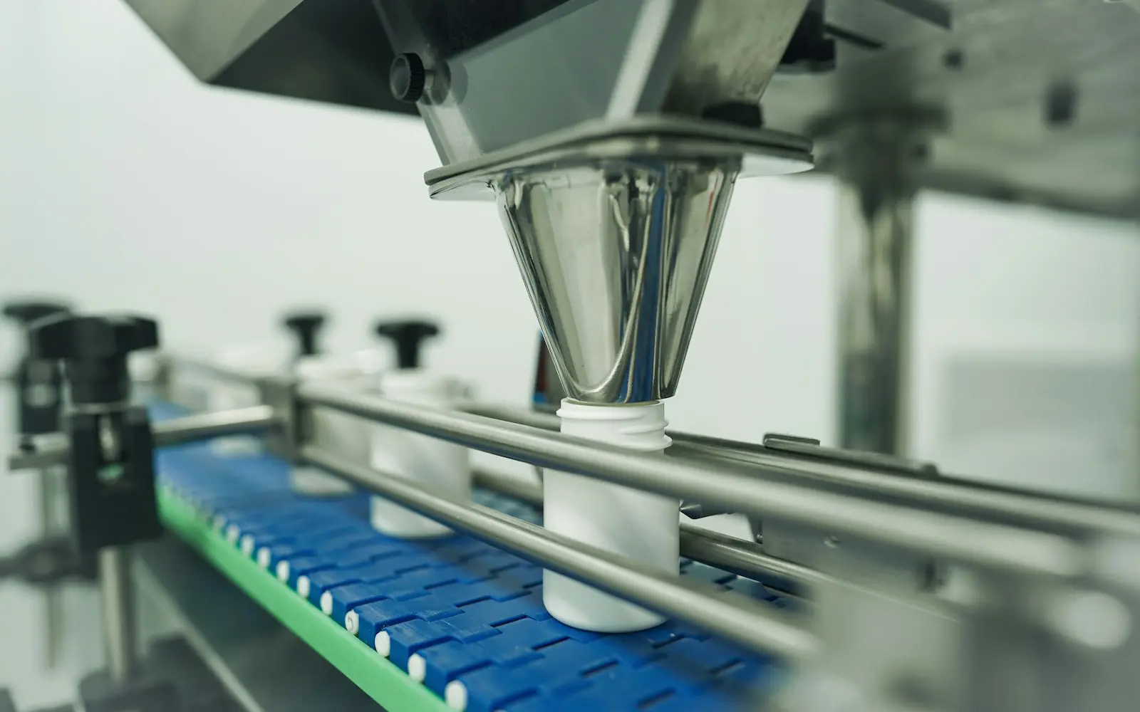 Bottles being filled on an automated production line